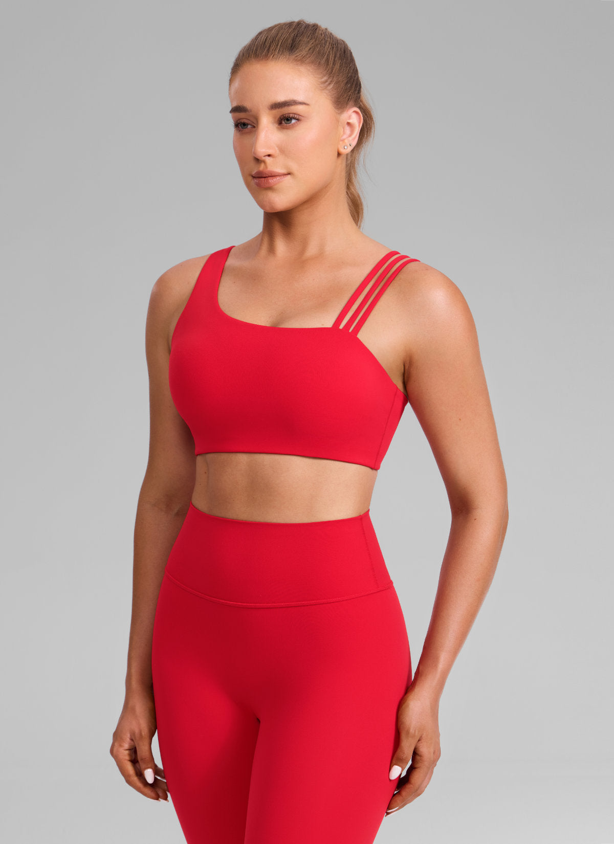 CRZ YOGA Damen Butterlift Sport-BH mit Asymmetrischen Trägern Aurora Rot