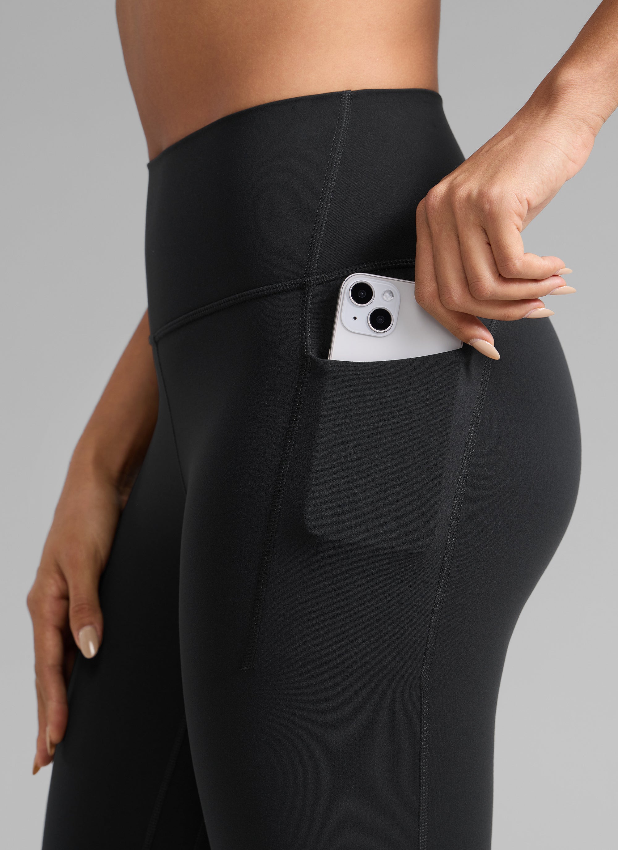 CRZ YOGA Damen Butterlift Leggings mit Seitentaschen - 64cm Schwarz