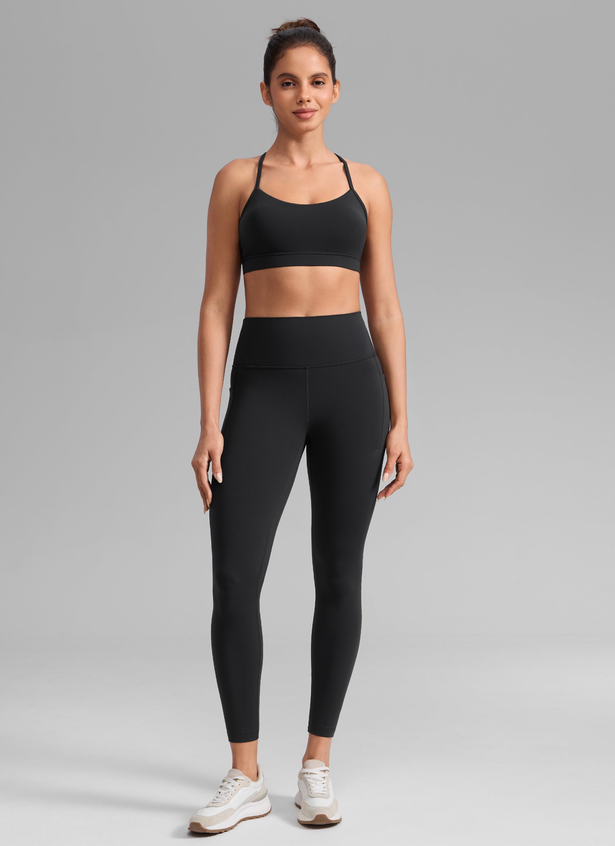 CRZ YOGA Damen Butterlift Leggings mit Seitentaschen - 64cm Schwarz