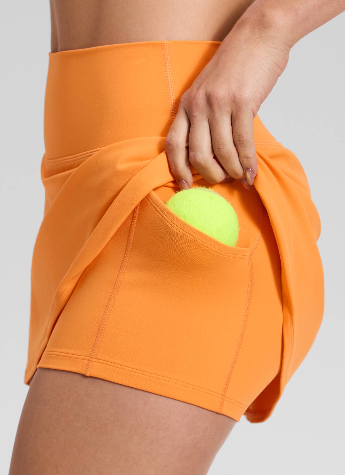 CRZ YOGA Damen Butterluxe Hohe Taille A-Line Tennis Röcke mit Taschen Tiger Orange