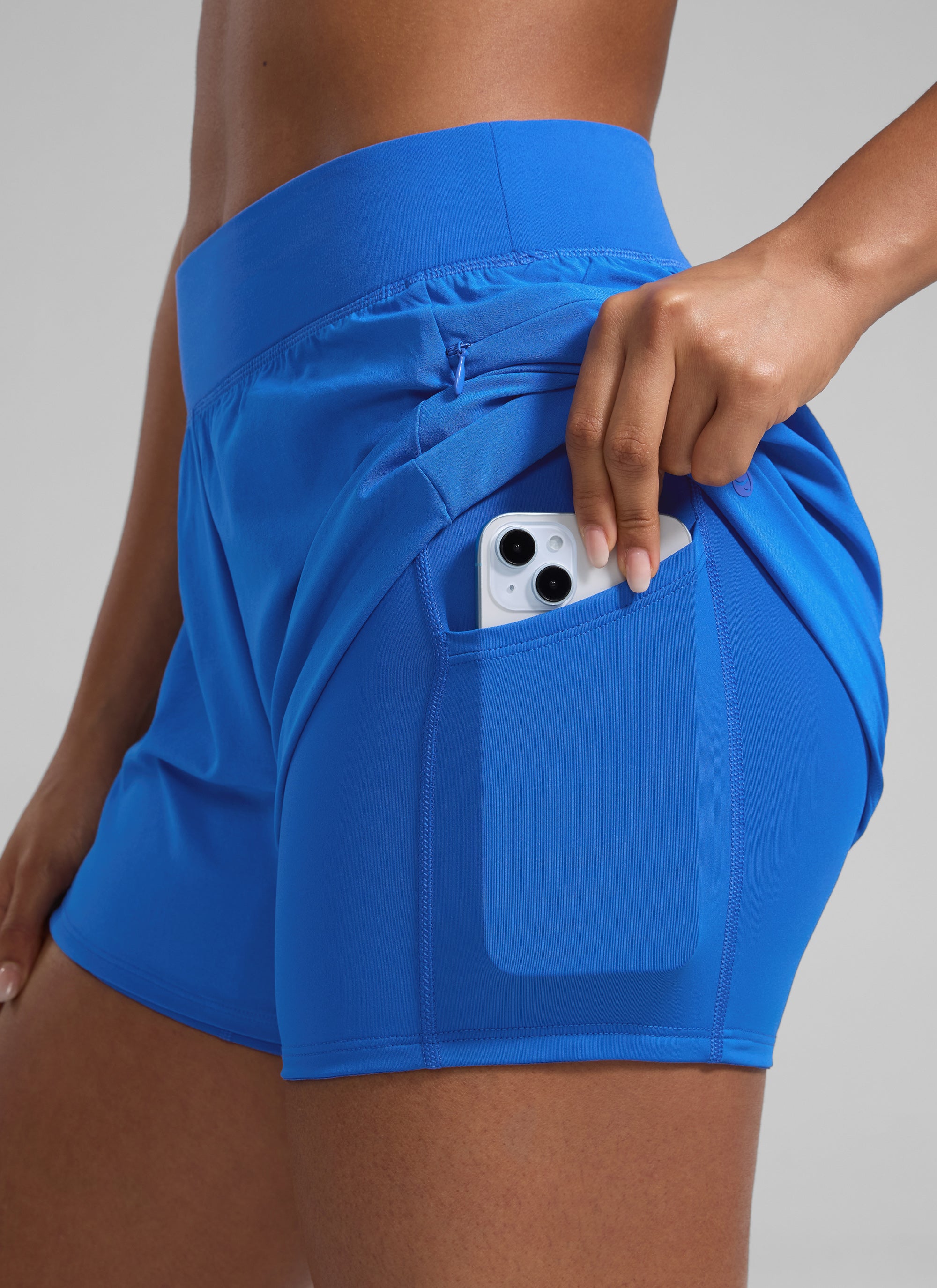 CRZ YOGA Damen 2 in 1 Laufshorts mit Reißverschlusstaschen - 8 cm Funkelndes Blau